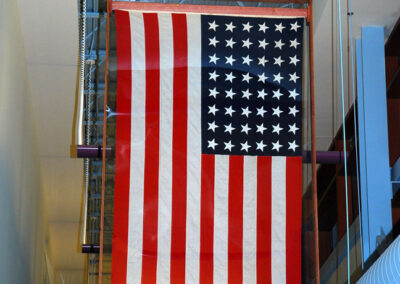 USA flag hung from sideward pole.