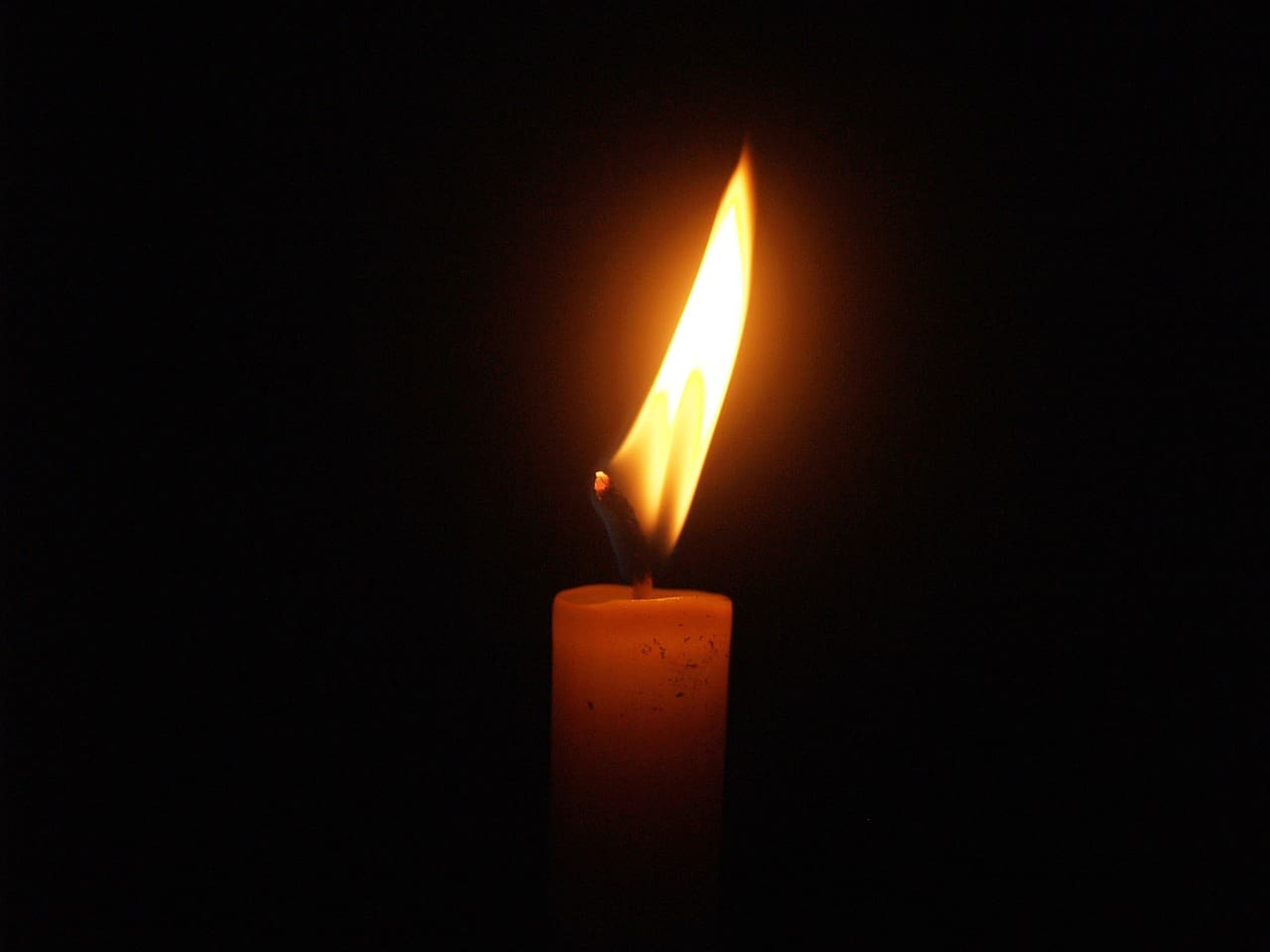 candle burning in the dark